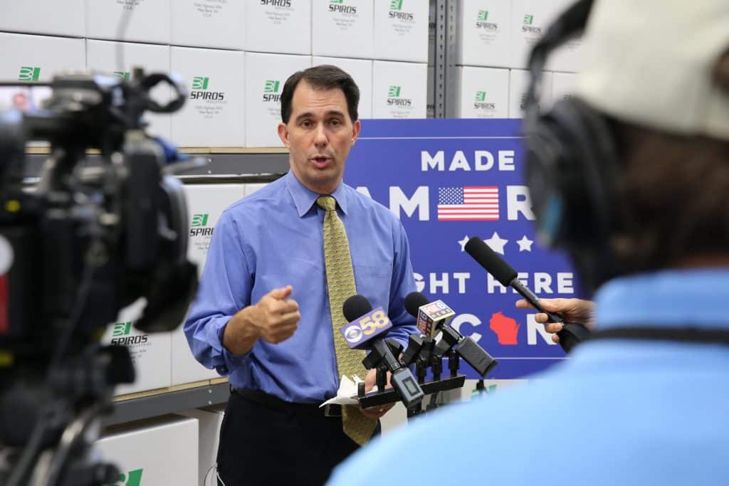 Scott Walker speaks with press at Spiros Manufacturing day